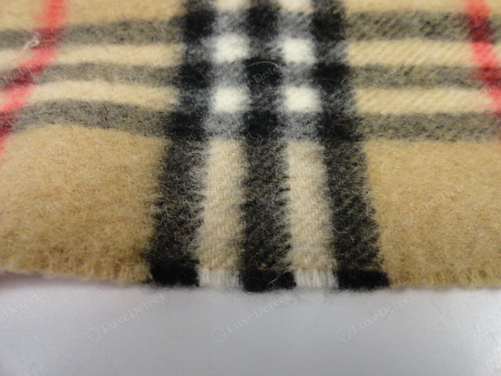 Genuine Burberry cashmere — soft dry airy hand, faint natural lustre, fine even halo, springs back