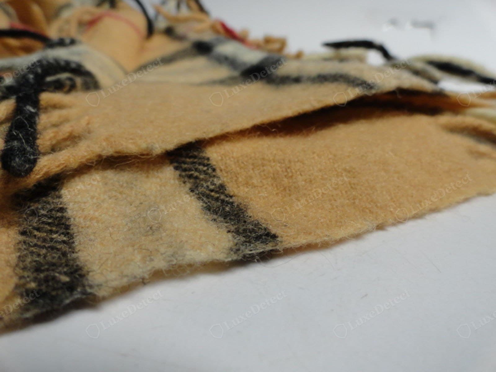 Counterfeit Burberry scarf check — printed on one side, blank or ghosted reverse, stripe proportions off