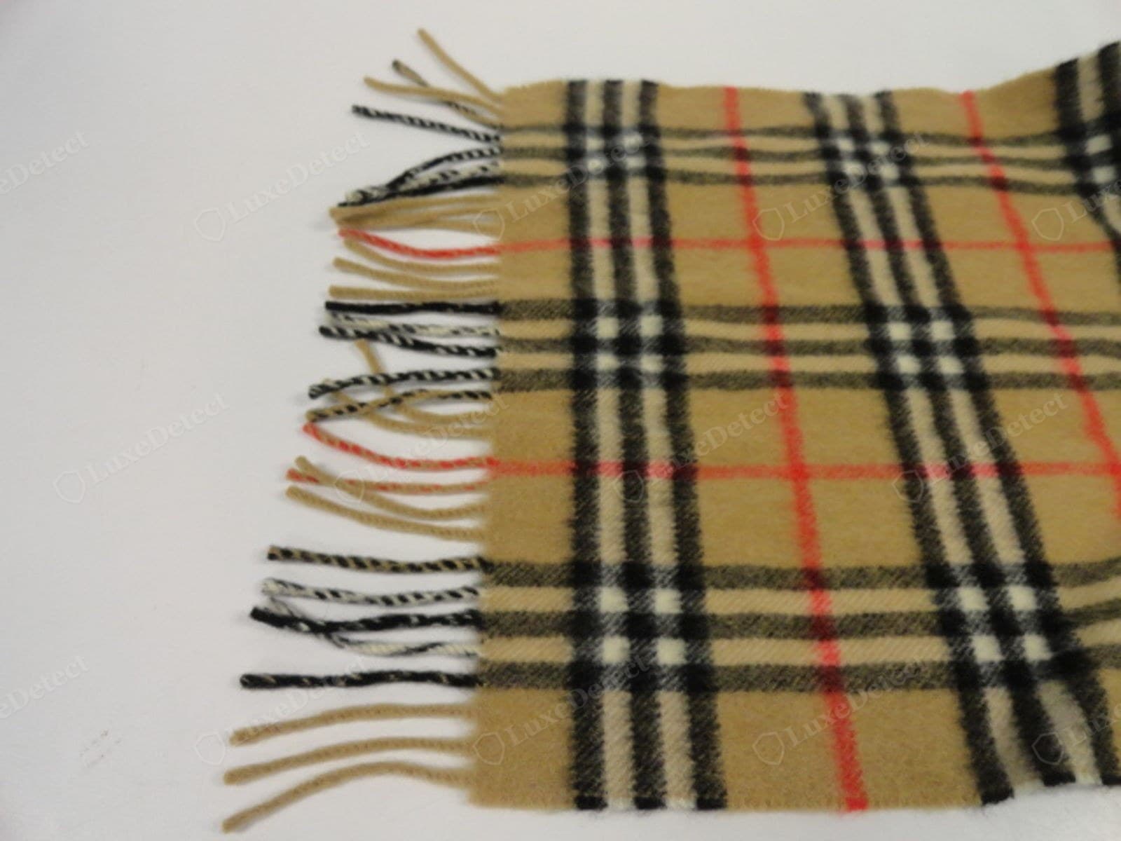 Genuine Burberry scarf fringe — even hand-twisted bundles, all one length, clean secure transition to the body