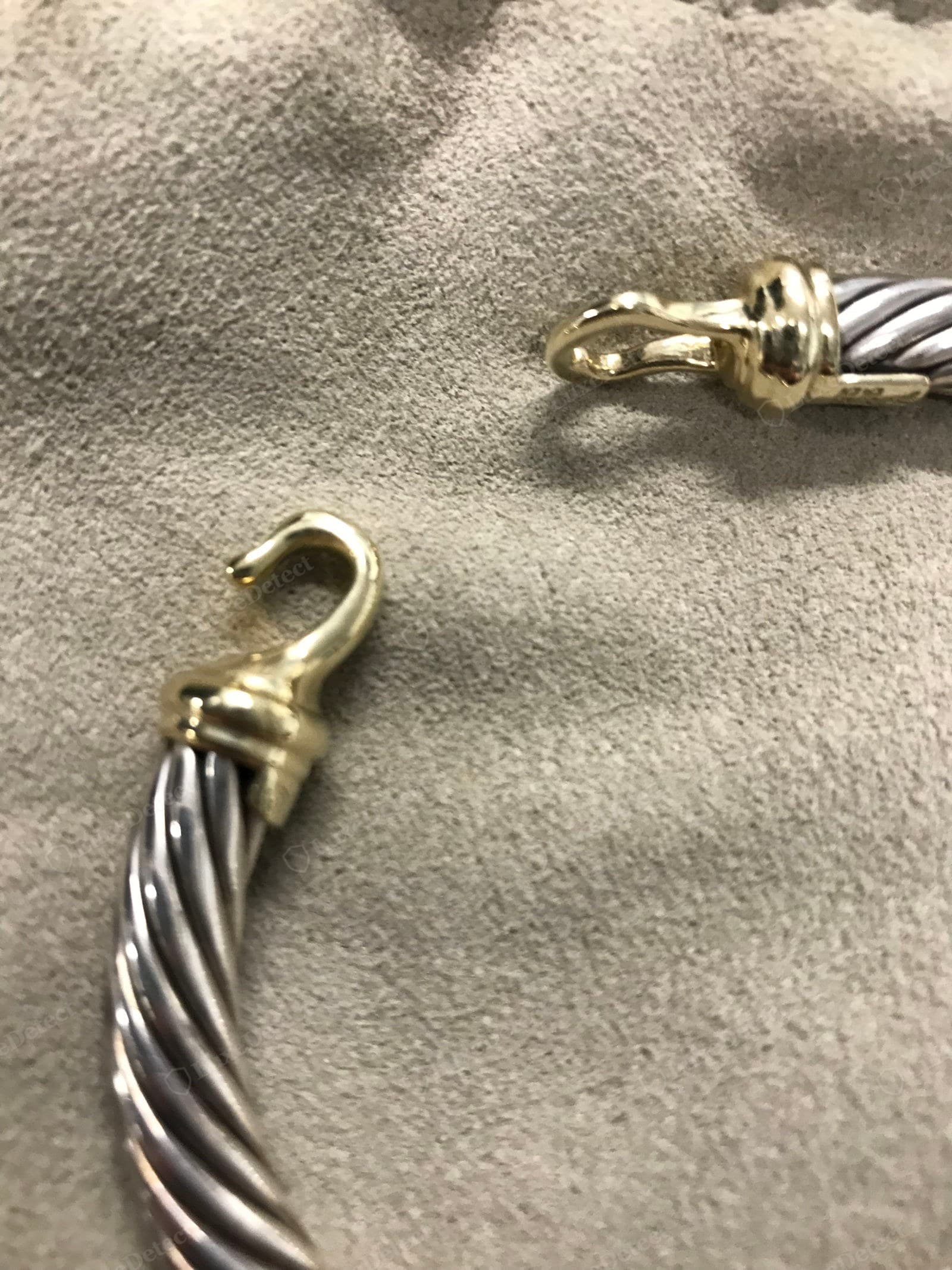 Genuine David Yurman clasp — a solid 14k gold hook-and-eye buckle, cleanly cast and symmetric, the cable twist running tight right up to the gold collar