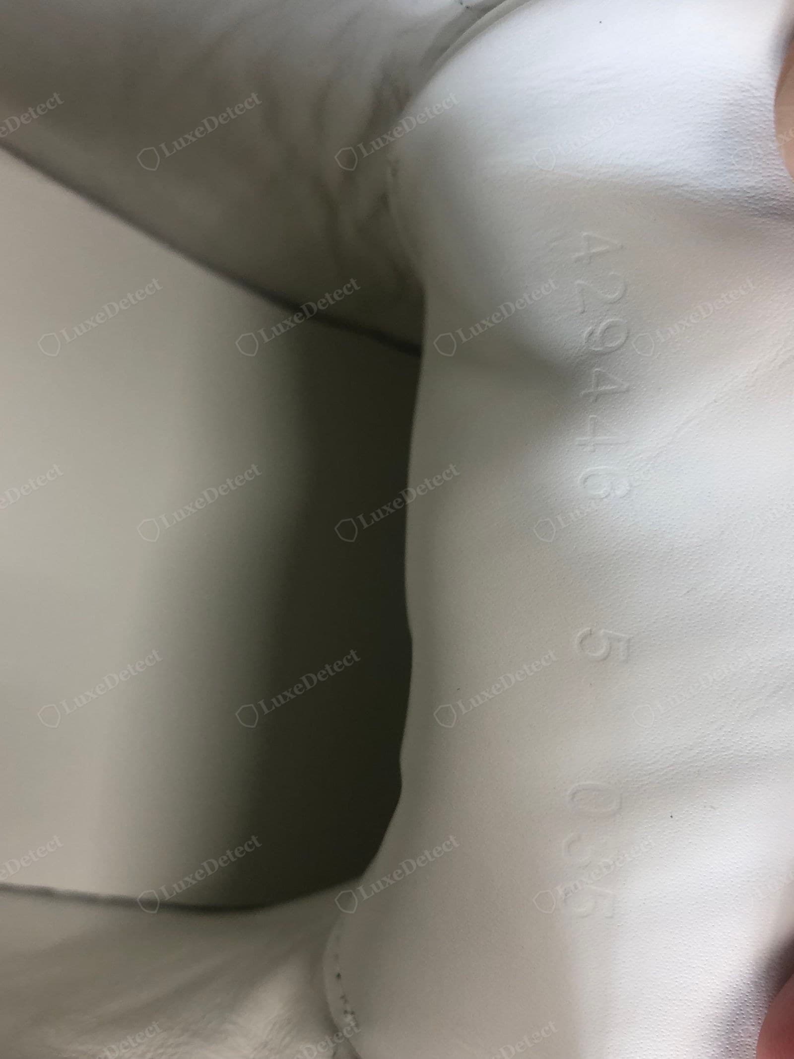 Counterfeit Gucci Ace size / style embossing — shallow, blobby, or wrong-font numbers, or a format Gucci does not use