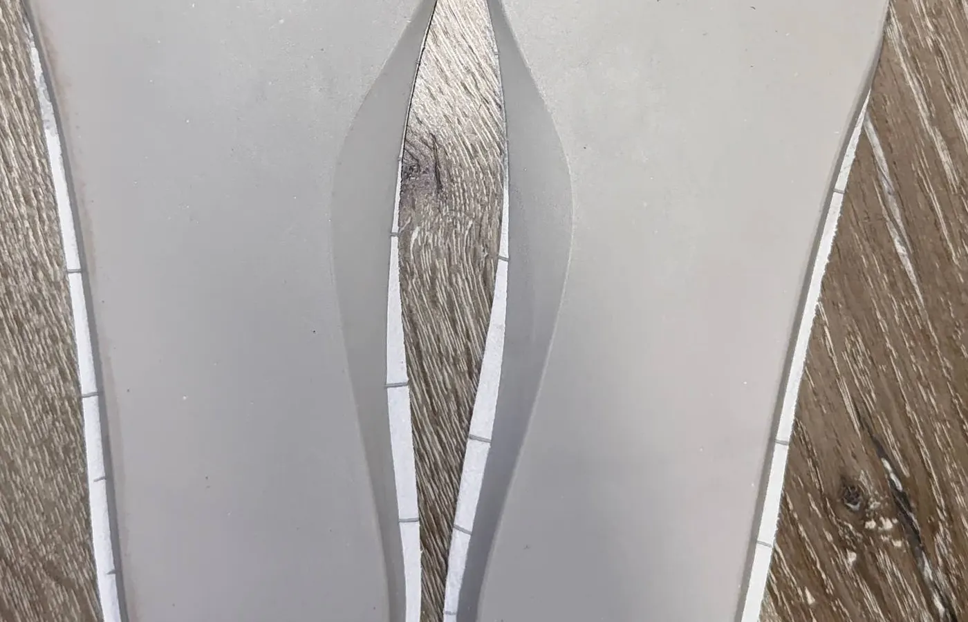 Removable insole undersides from a white pair — both moulded T13M5R2, identical left and right