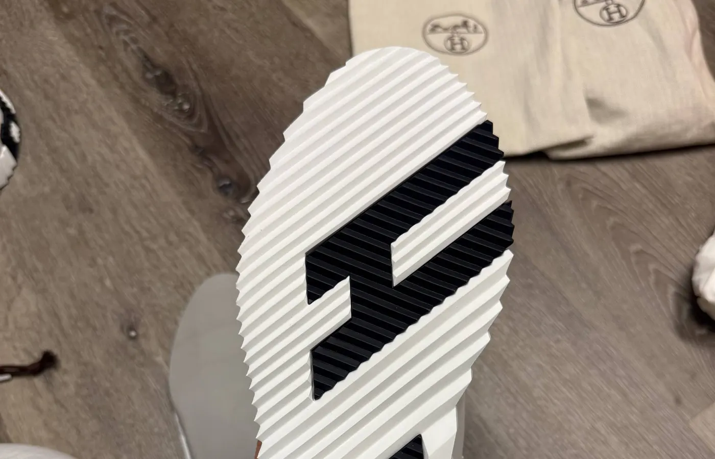 Genuine Hermès Bouncing outsole — the sculpted H is formed by the ridge pattern stepping up and down, with MADE IN ITALY debossed at the arch