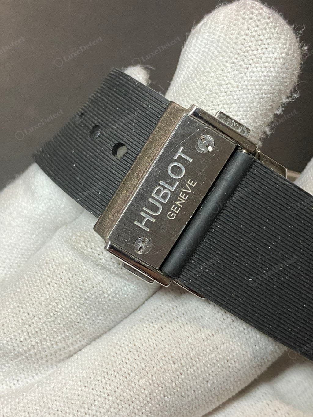 Counterfeit Hublot strap keeper — soft, shallow moulded text on thinner, floppier rubber