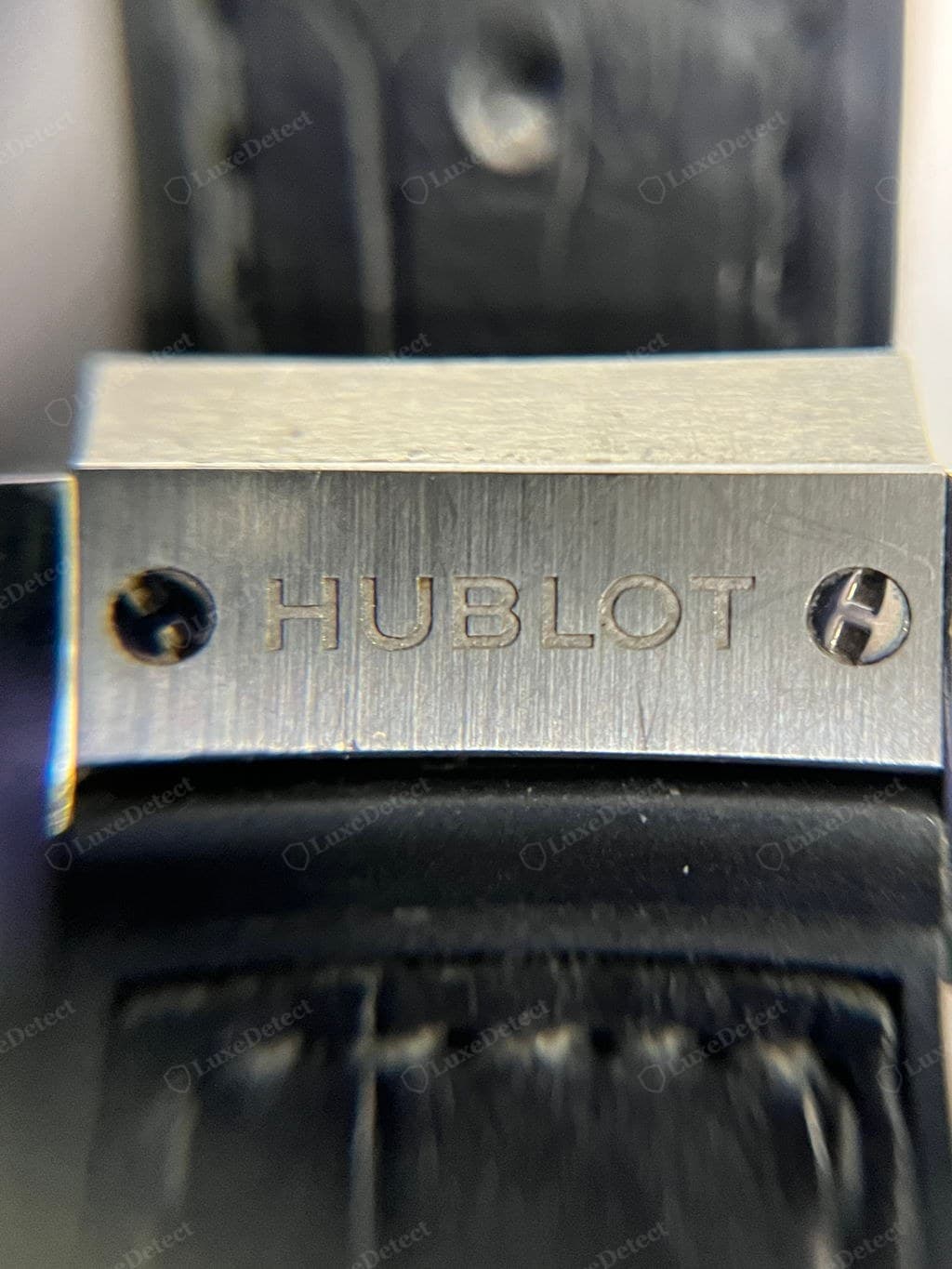 Genuine Hublot strap keeper — the moulded "HUBLOT" crisp and correctly proportioned on dense structured rubber