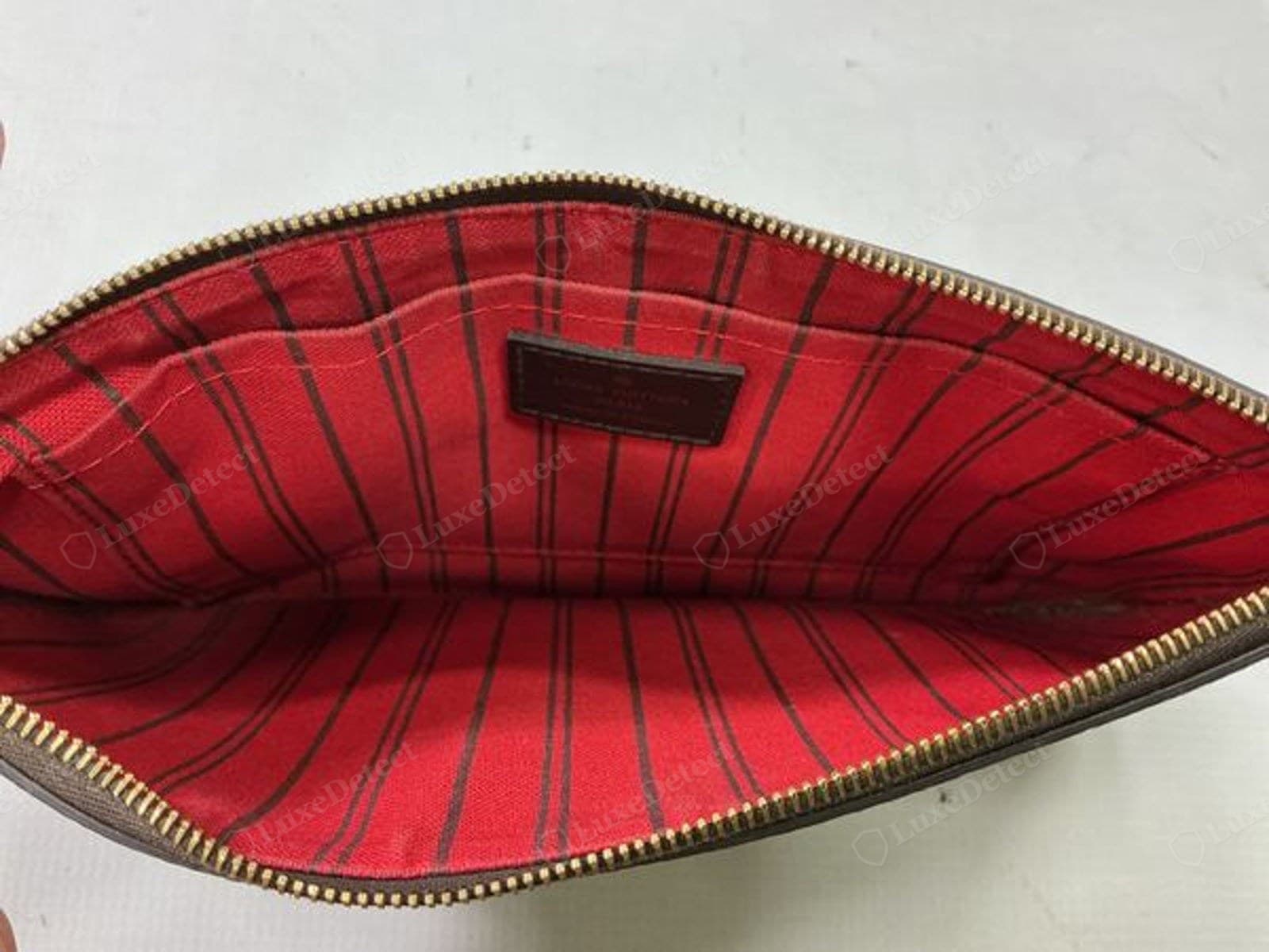 Counterfeit LV heat stamp — a small, faint stamp on a leather patch against a striped lining whose stripes are wavy and unevenly pitched (genuine LV lining stripes are evenly spaced)