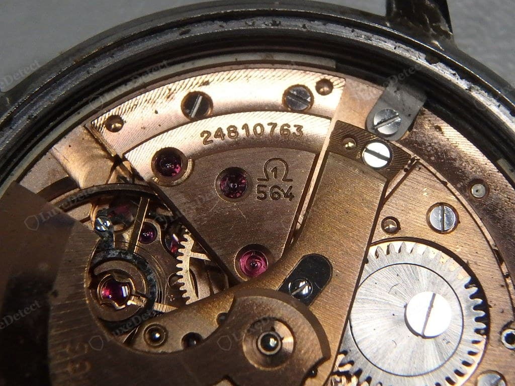 Genuine Omega movement — clean bridge finishing, the Omega logo and calibre engraved, the balance running true