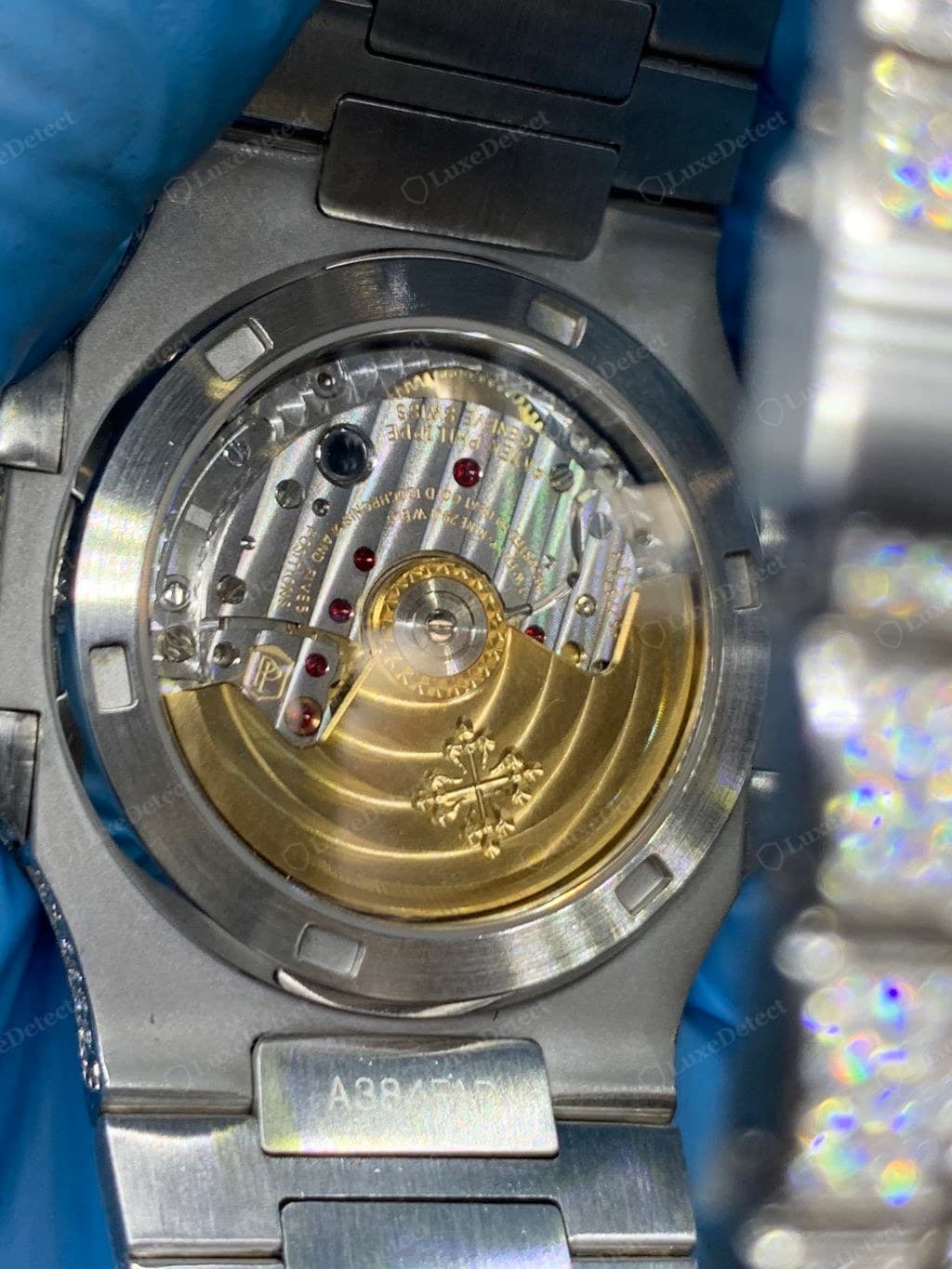 Counterfeit Patek Philippe — engraving and movement detail that do not hold up next to a genuine reference