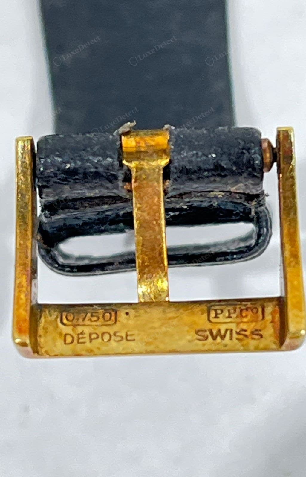 Genuine Patek Philippe clasp — the Calatrava cross and "PATEK PHILIPPE" crisply engraved, clean machining