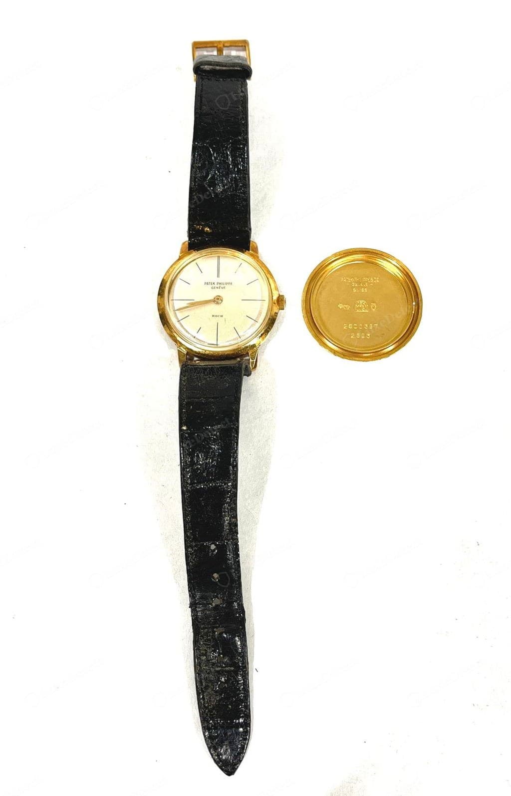 Genuine Patek Philippe Calatrava — the dial straight-on with the applied signature and applied markers, and the case back