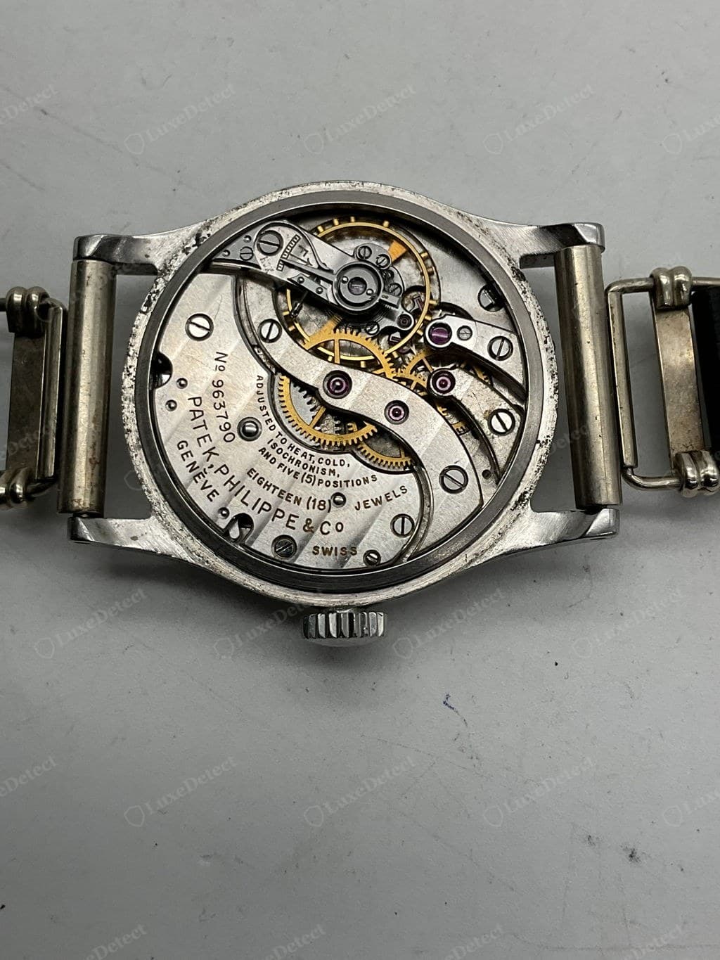 Genuine Patek Philippe movement — hand-polished bevels, even Côtes de Genève, the "PATEK PHILIPPE GENÈVE" and seal engraving crisp
