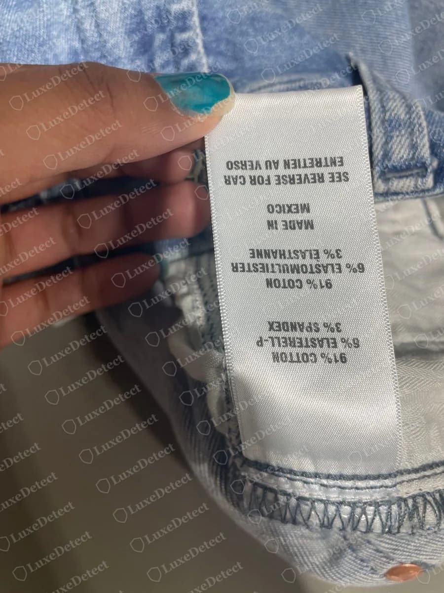 Genuine 7 For All Mankind white satin fibre label printing 91% cotton, 6% elastomultiester and 3% spandex in English and French, followed by MADE IN MEXICO