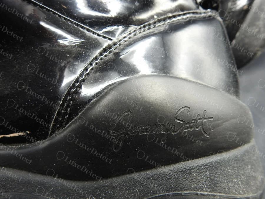 Genuine Jeremy Scott signature in script, moulded into the black rubber heel of a Wings 3.0 sneaker