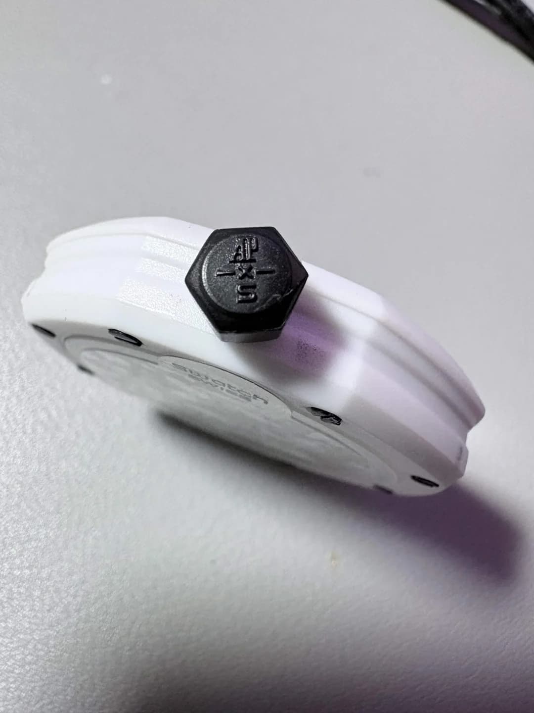 Fake AP x Swatch Royal Pop crown — compare the edge milling, profile, and proportions against the genuine crown above.