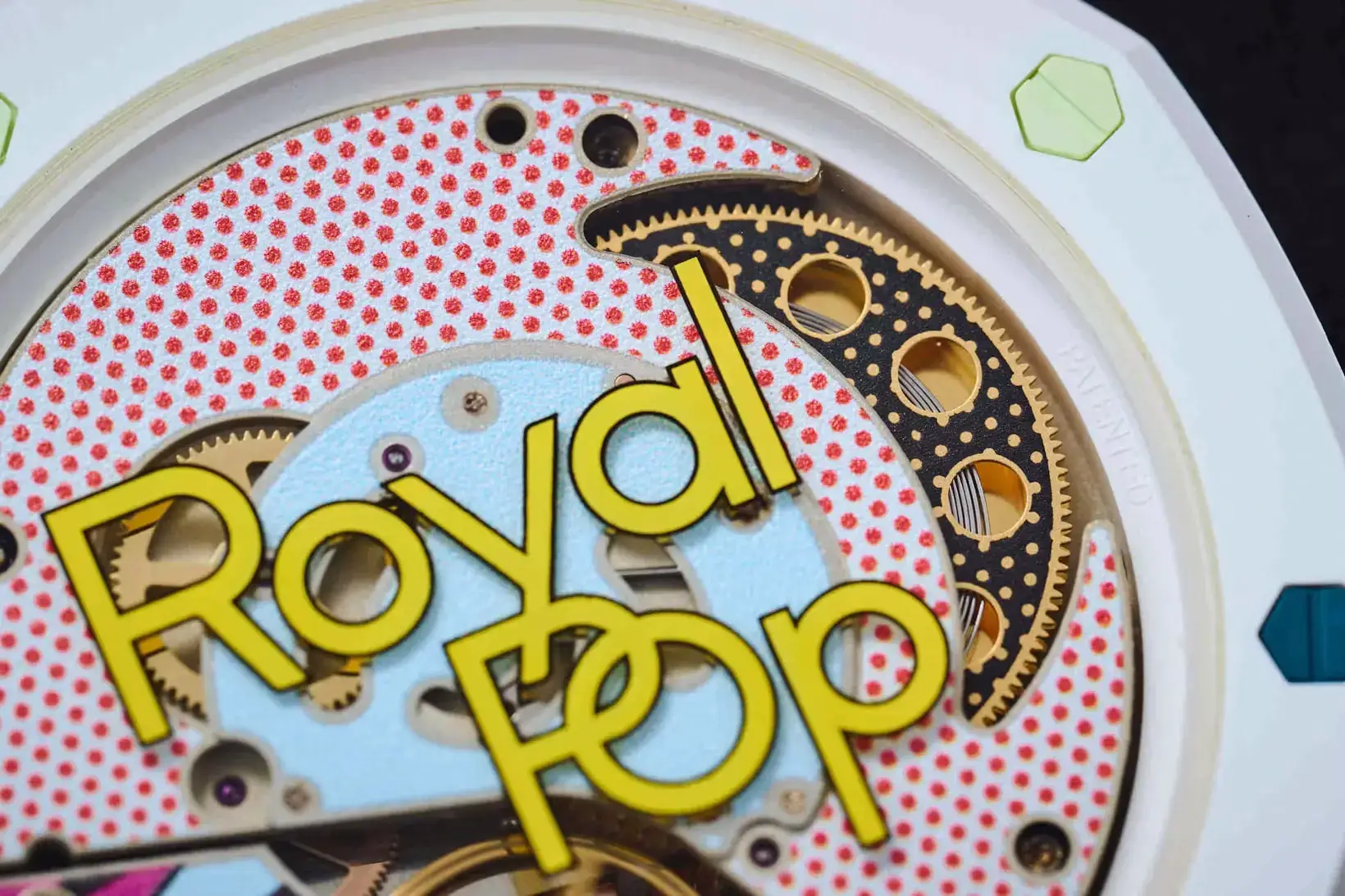 Real AP x Swatch Royal Pop movement through the caseback (view 1) — genuine Swatch Group rotor and finishing.