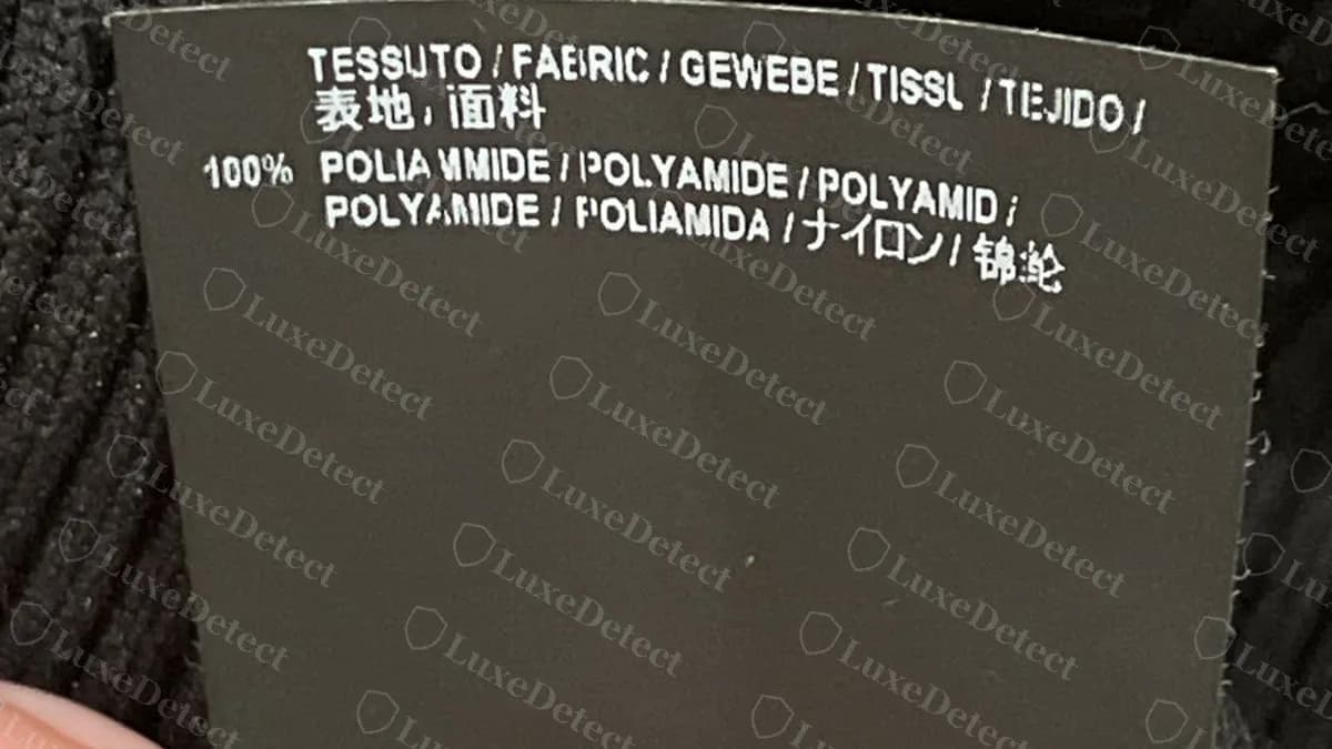 Genuine Balenciaga composition label: TESSUTO / FABRIC in several languages and 100% POLIAMMIDE / POLYAMIDE listed in eight languages on a black tag