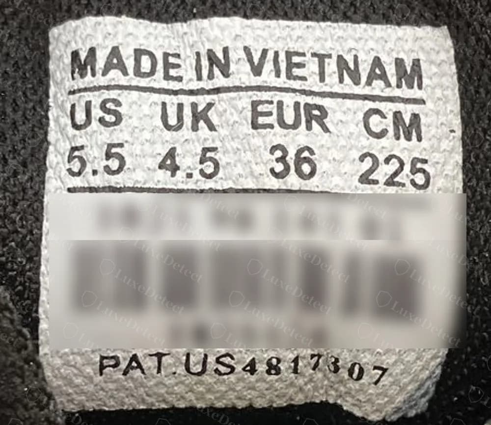 A second counterfeit Track carrying the same generic MADE IN VIETNAM barcode label, with US 5.5, UK 4.5, EUR 36 and CM 225 (barcode numbers blurred)