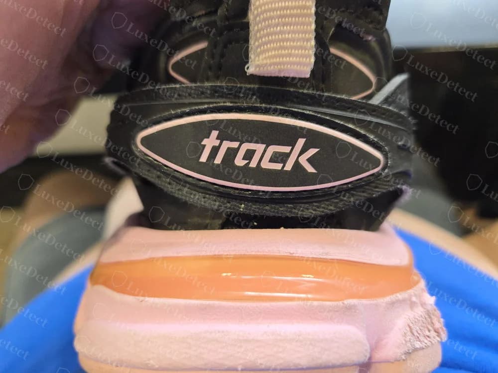 Genuine Balenciaga Track heel plate reading track, above the layered pink sole