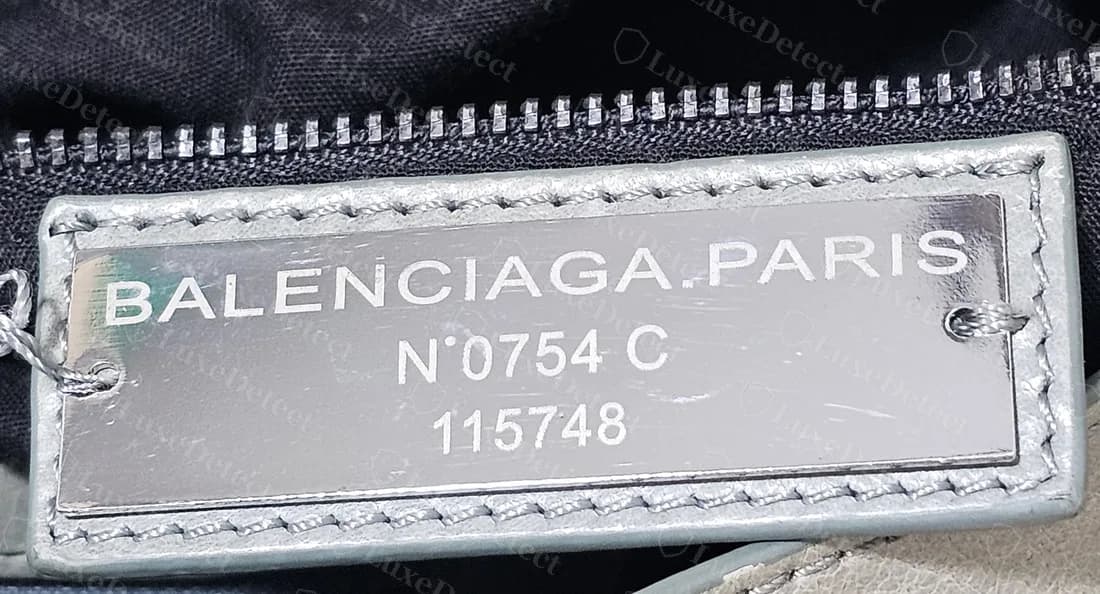 Counterfeit City plate reading N°0754 C over 115748, the same plate number seen on another counterfeit City