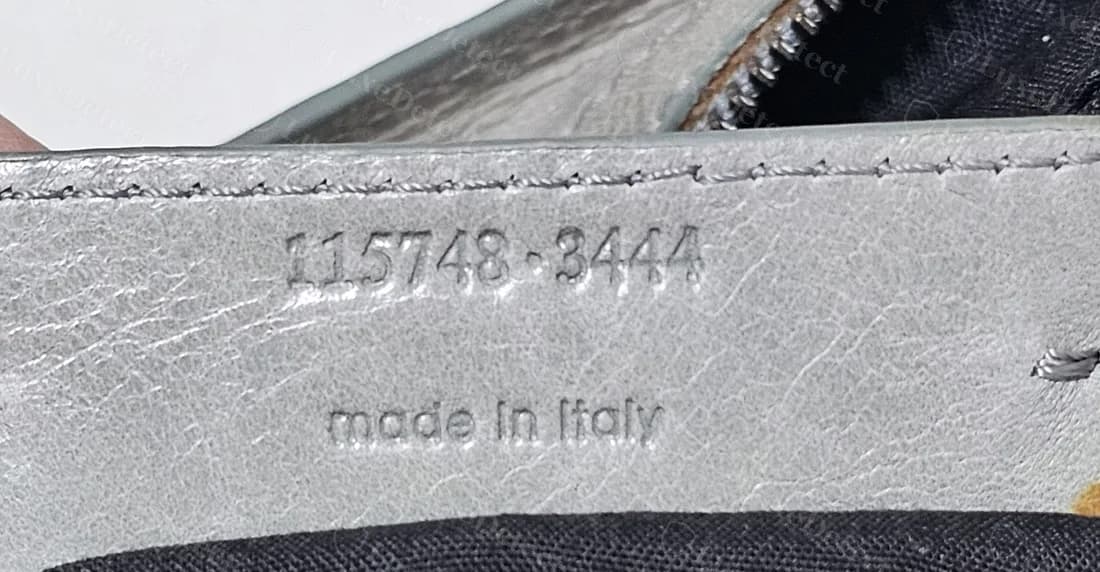 Counterfeit City tab reading 115748 3444 with "made in italy" below, the same pair of numbers seen on other counterfeit City bags
