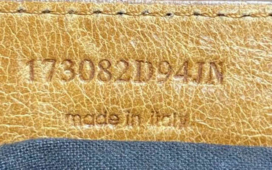 Counterfeit City tab with a style number that runs into letters, 173082D94JN, instead of six plain digits