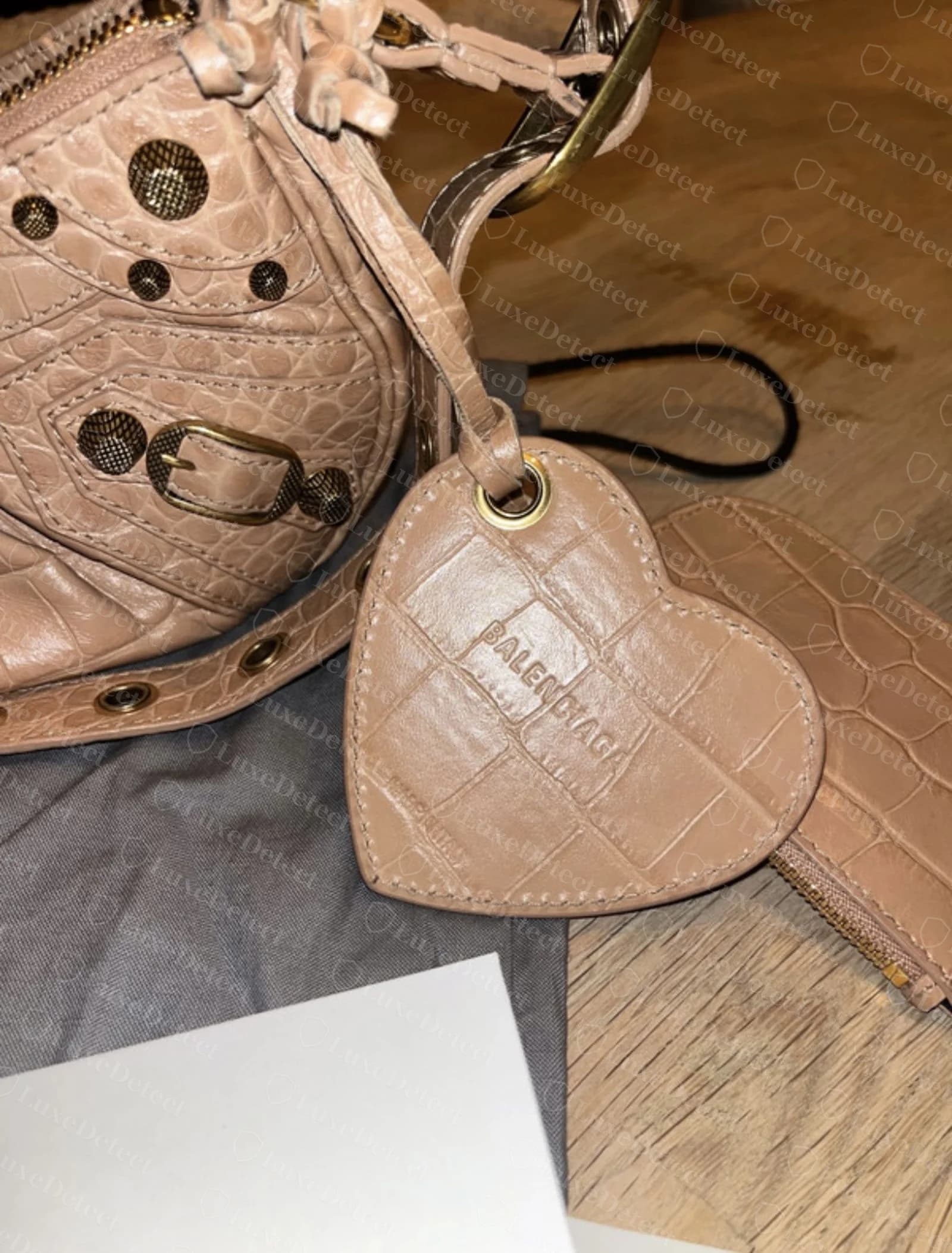 Authentic Balenciaga Cagole heart-shaped leather tag in tan croc-embossed leather with crisp BALENCIAGA embossing
