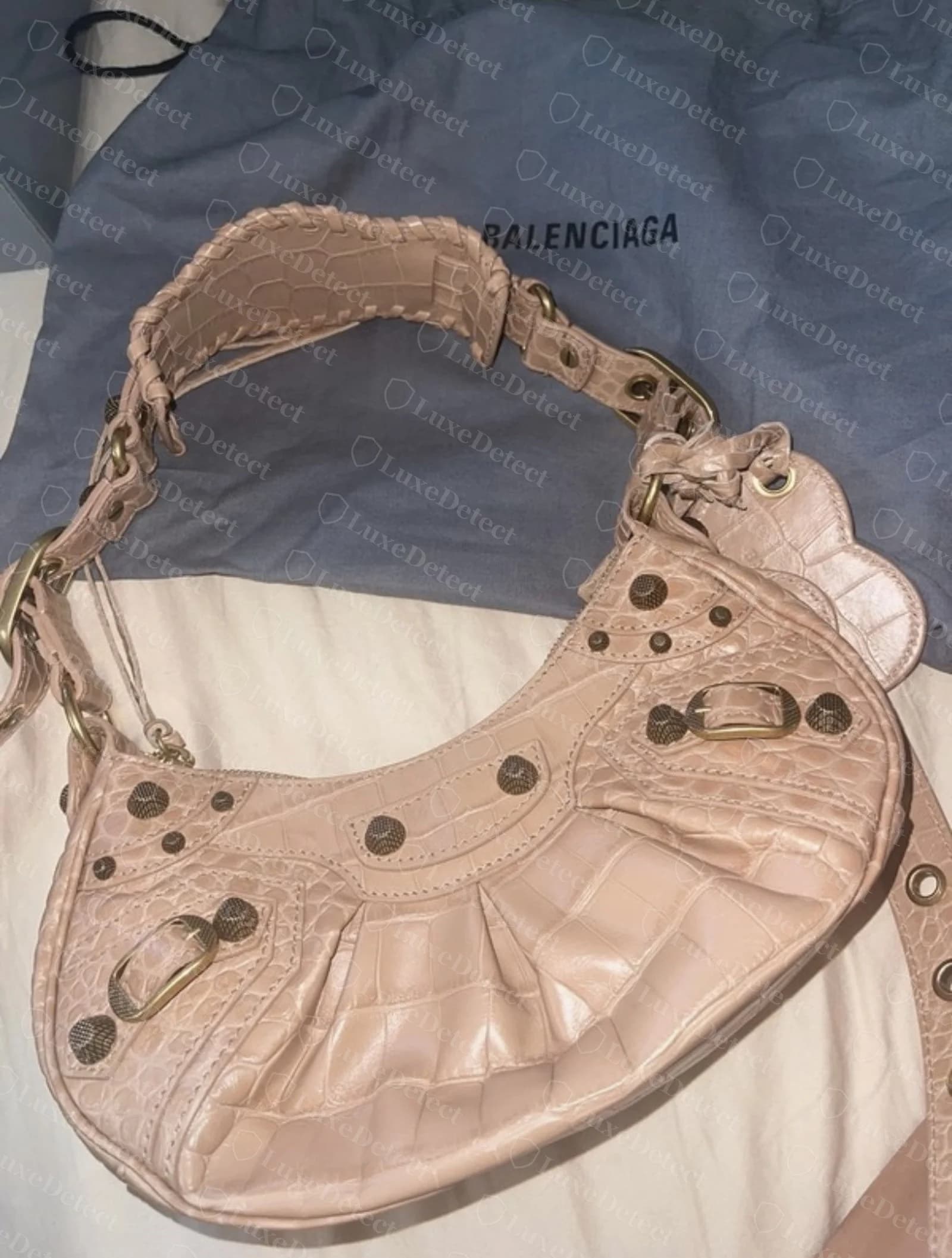 Authentic Balenciaga Cagole whipstitched handle showing thick, dimensional leather lacing wrapped at consistent intervals