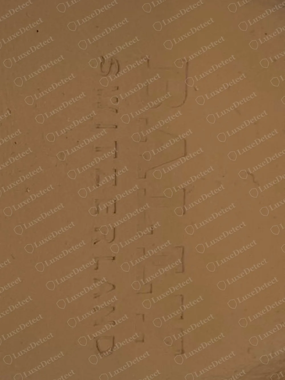 Genuine Bally insole with BALLY pressed vertically into the tan leather, SWITZERLAND in smaller letters beside it