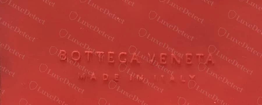 Fake Tire boot with red outsole: "MADE IN ITALY" moulded under the brand name, a line the genuine Tire outsole does not carry.