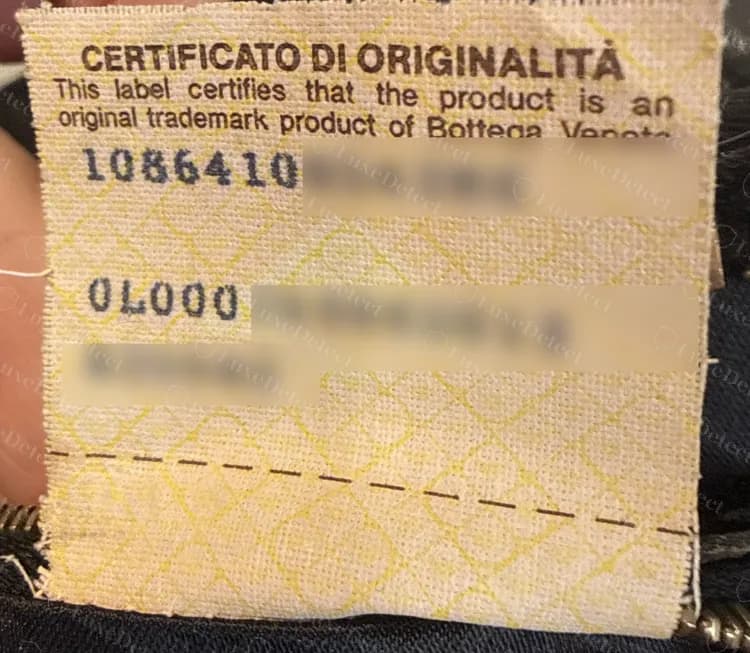 Genuine yellow security-pattern label from an older bag: bilingual heading in brown, numbers in dark blue (we have blurred most of the numbers)