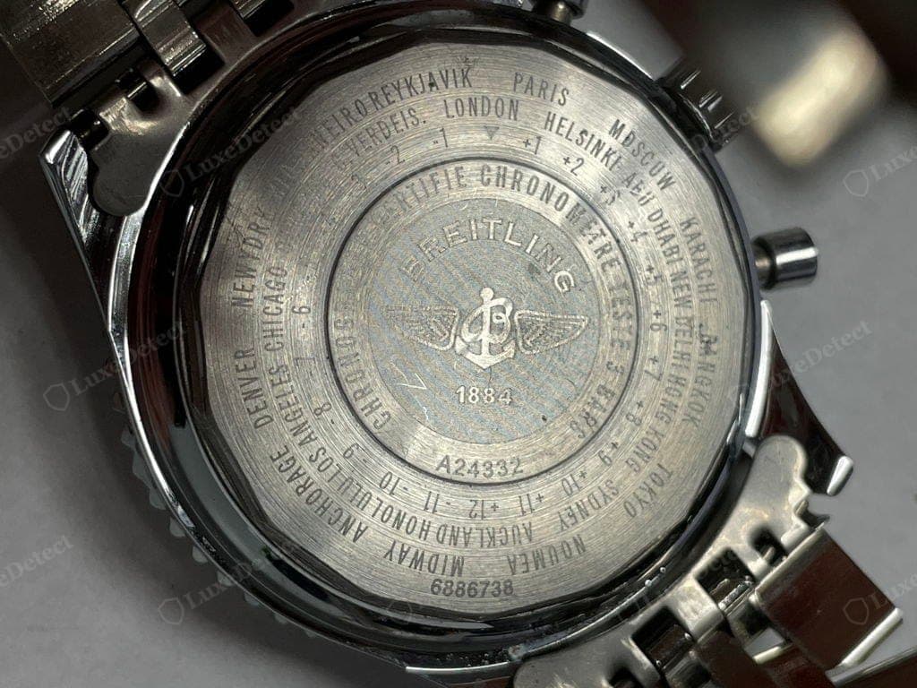 Caseback of a watch from a counterfeit order — a world-time city ring and the 1884 logo, legible but soft and uneven in the engraving, a reminder that a caseback has to be judged together with the movement and the rest of the watch