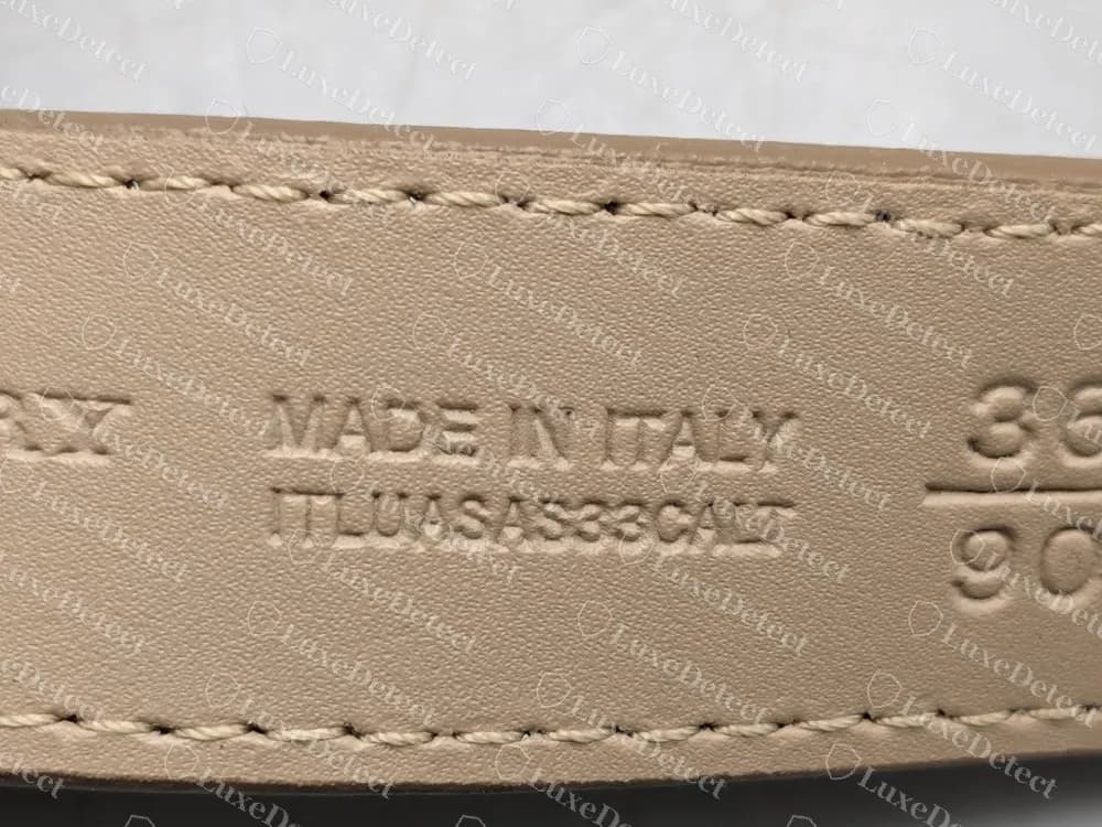 Fake-ruled belt interior with the same Made in Italy line, code string and 36 over 90 size, which looks right