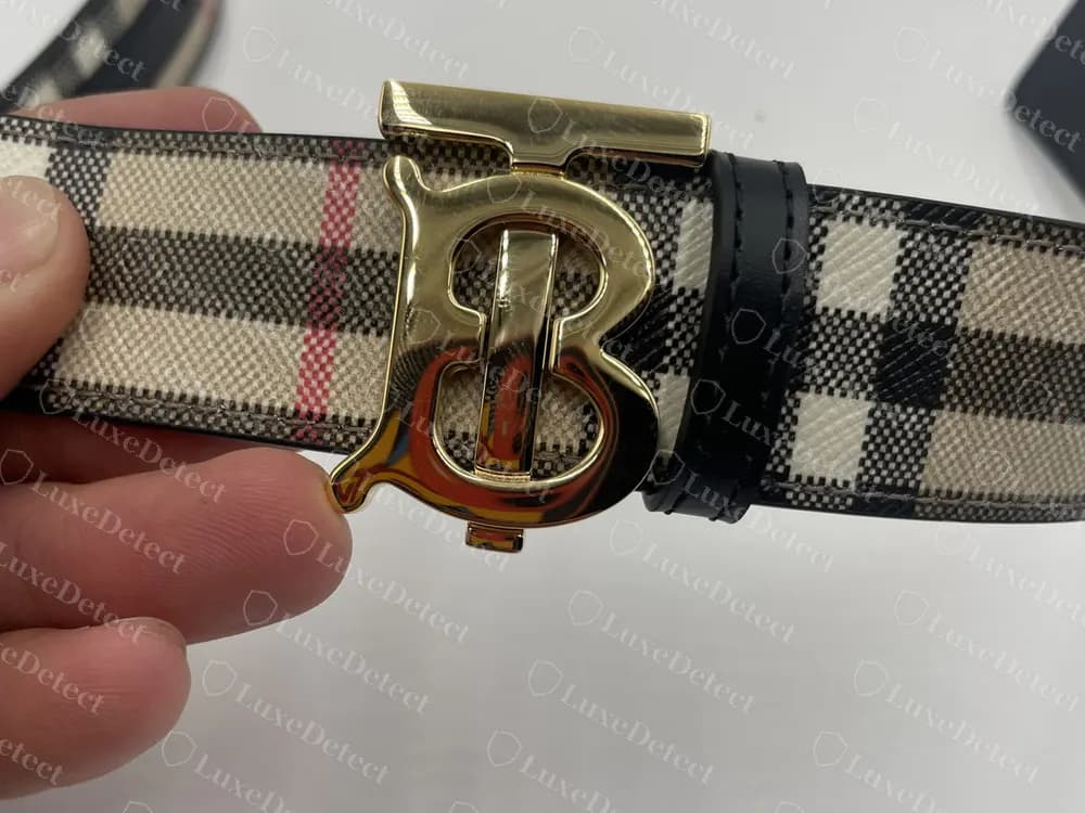 Authentic gold TB monogram buckle on a Vintage check belt, smooth finish and clean letter edges