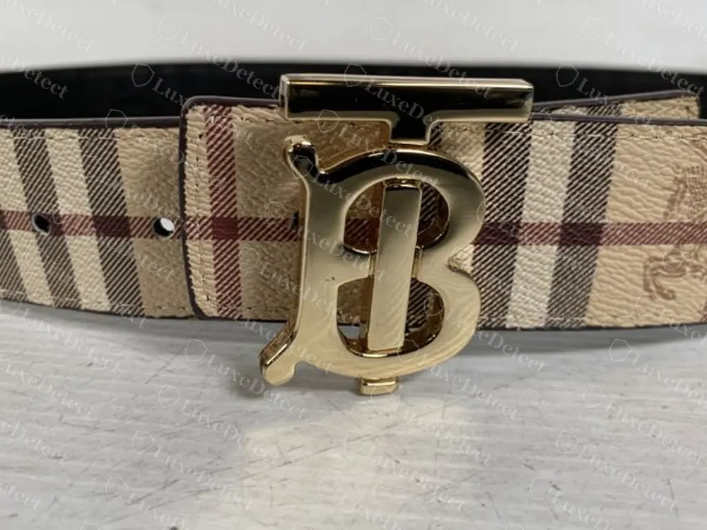 Fake-ruled TB belt on Haymarket check with a gold buckle that looks close to the genuine one from the front