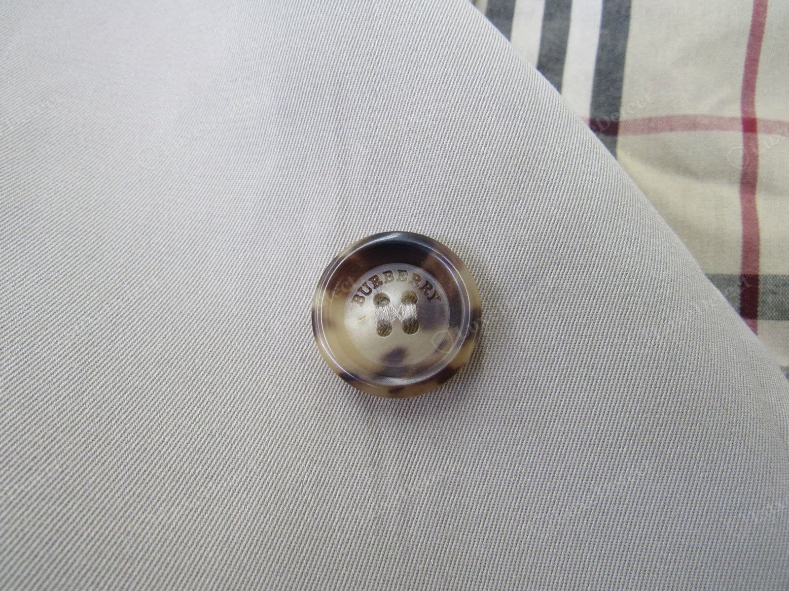 Genuine Burberry trench button — domed horn-look resin, crisp BURBERRY LONDON engraving, shank-sewn tight