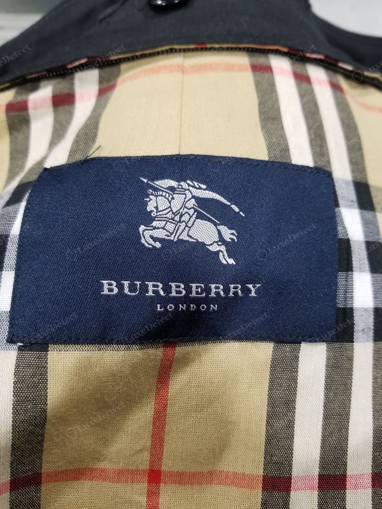 Counterfeit Burberry main label — printed or crudely woven, fuzzy Knight Device, wrong logo for the era