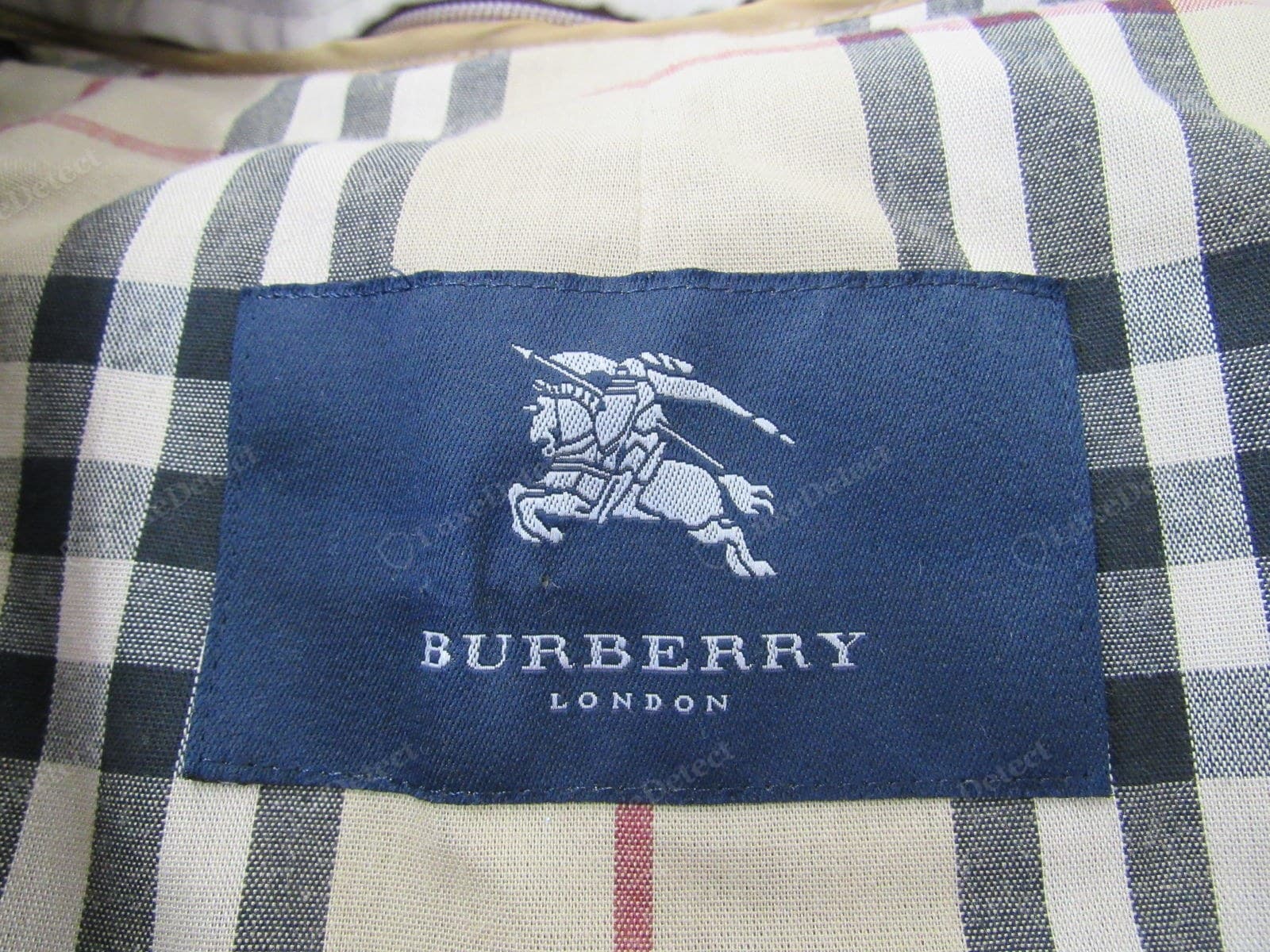 Genuine Burberry main label — densely woven, sharp Equestrian Knight Device, sewn flat and even