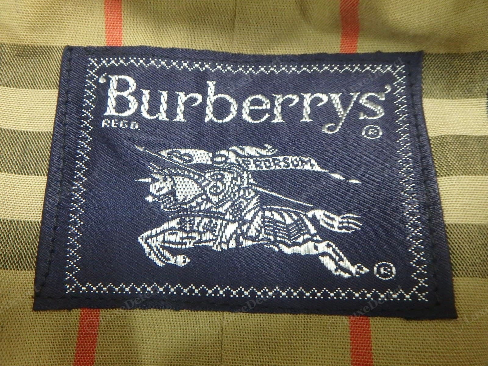 Genuine vintage Burberry label — the older "Burberrys" (with the S) label styling, cleanly woven, consistent with the coat's era