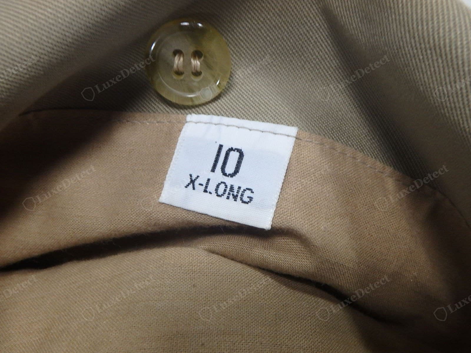 Genuine Burberry size/style label — the size and style code in the format the coat's era used, cleanly printed