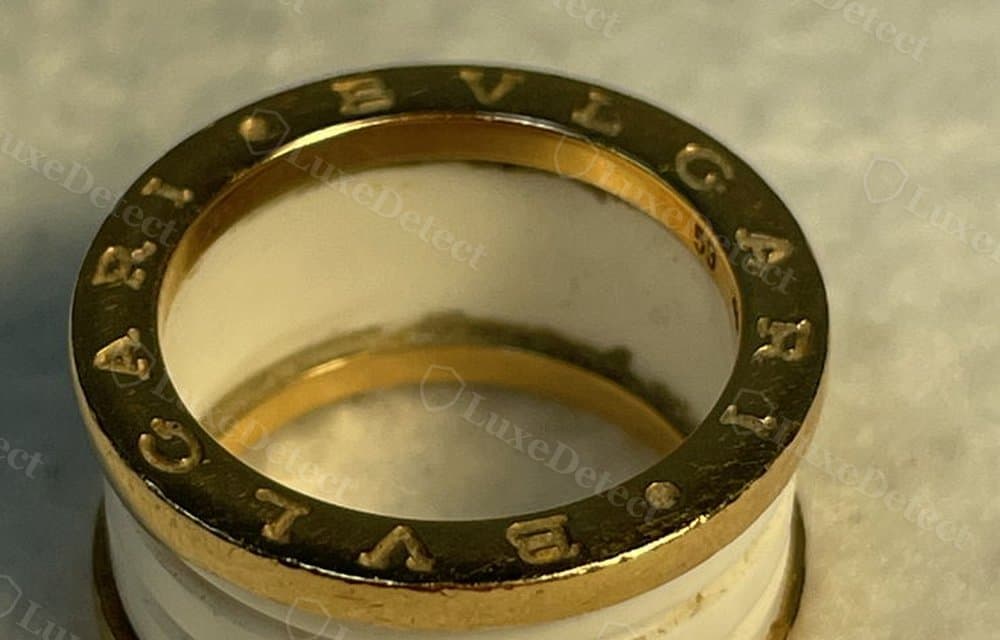 Authentic B.zero1 engraving: even letter weight, consistent spacing, and a clean mirror-polished channel wall.