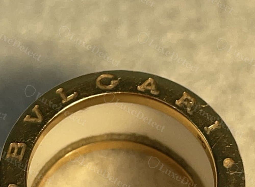 Authentic BVLGARI engraving: even letter spacing on a mirror-polished band.