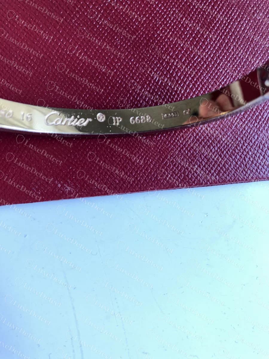 A second counterfeit Love bracelet, a different size and metal colour, stamped with the same serial IP 6688 inside the band