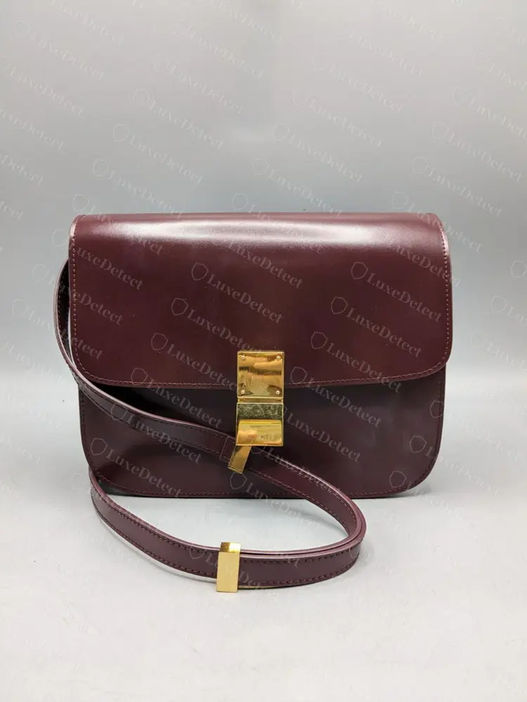 Counterfeit Medium Classic Box in burgundy. The shape, the clasp and the strap keepers all look correct at this distance, which is typical of the fakes we review.