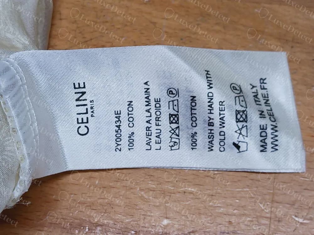 Counterfeit Celine lace blouse: the same style code 2Y005434E on a care label of the same layout