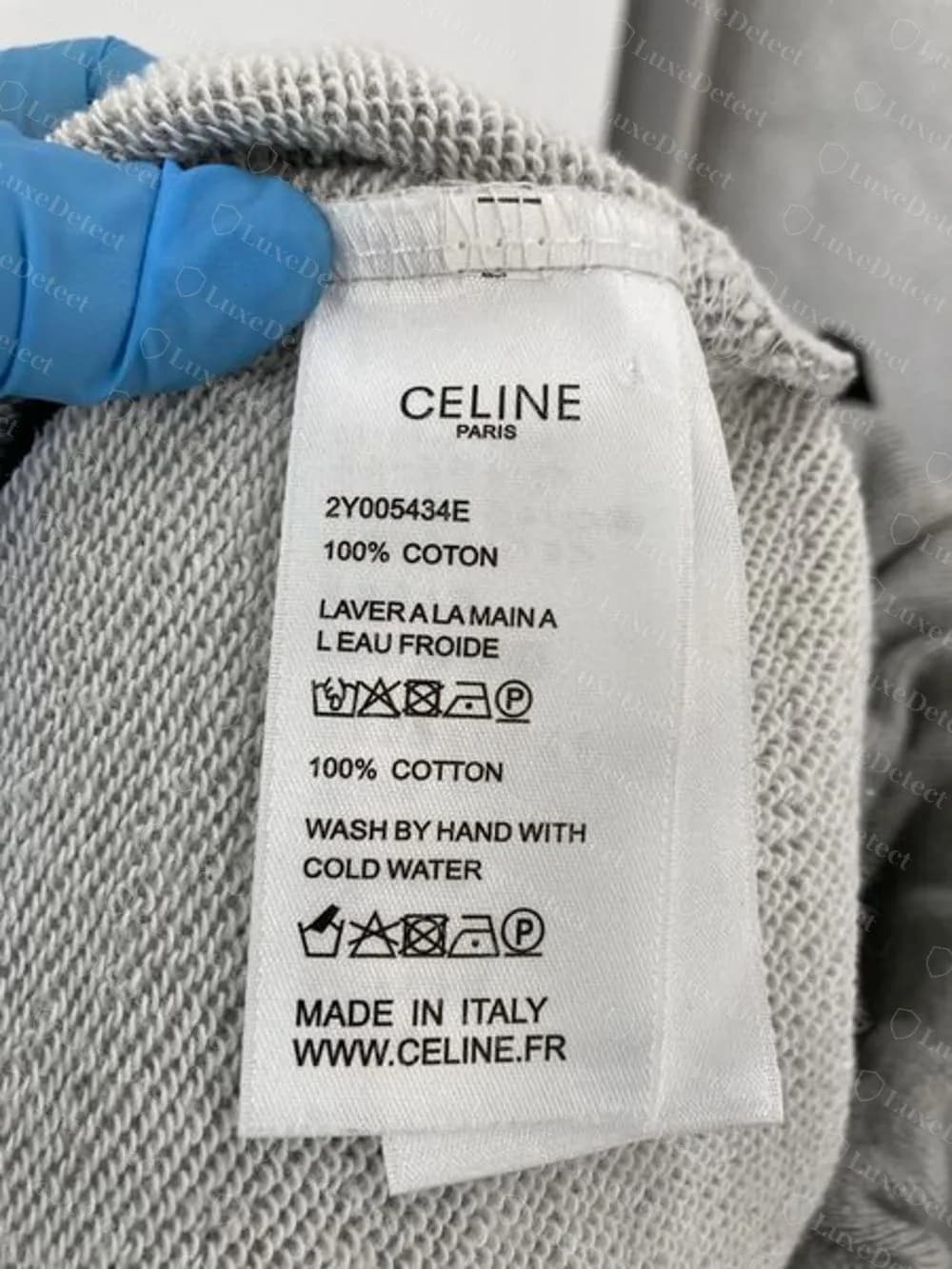 Counterfeit Celine sweat shorts: care label with style code 2Y005434E, Made in Italy and WWW.CELINE.FR