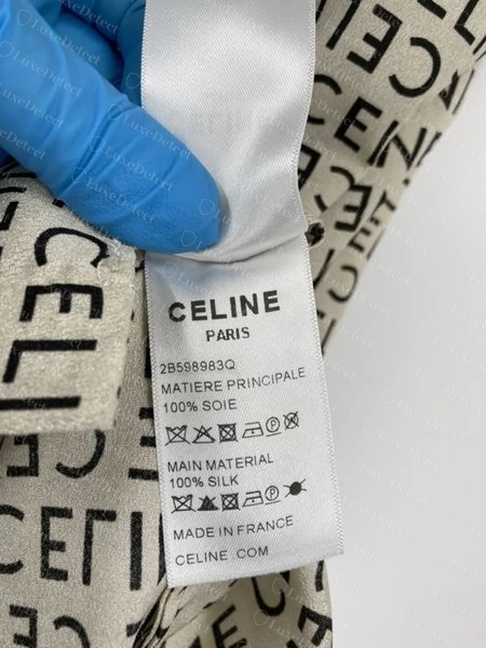 Blusa de seda Celine falsificada, painel em inglês: 100% SOIE, 100% SILK, MADE IN FRANCE e CELINE.COM