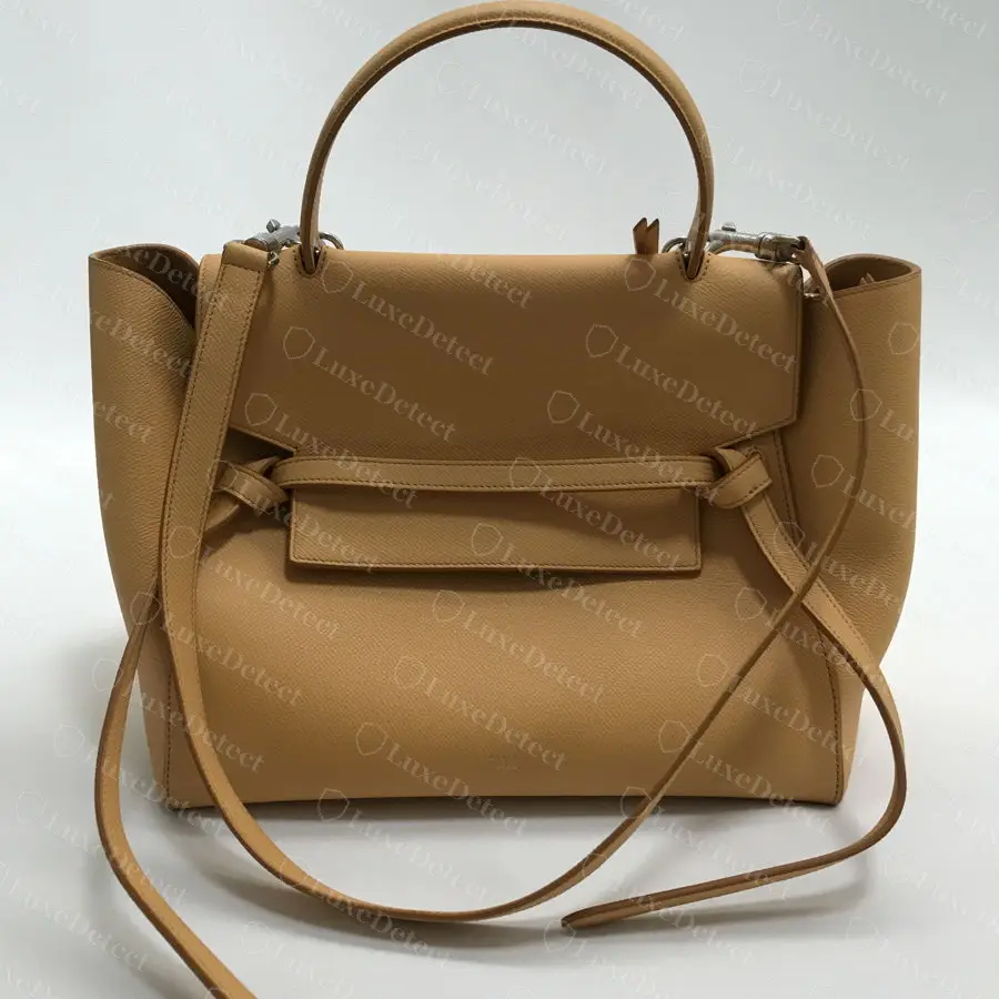 Authentic Celine Mini Belt Bag: a top handle, a flap wrapped by a belt-like leather strap, winged sides, and no Triomphe clasp.
