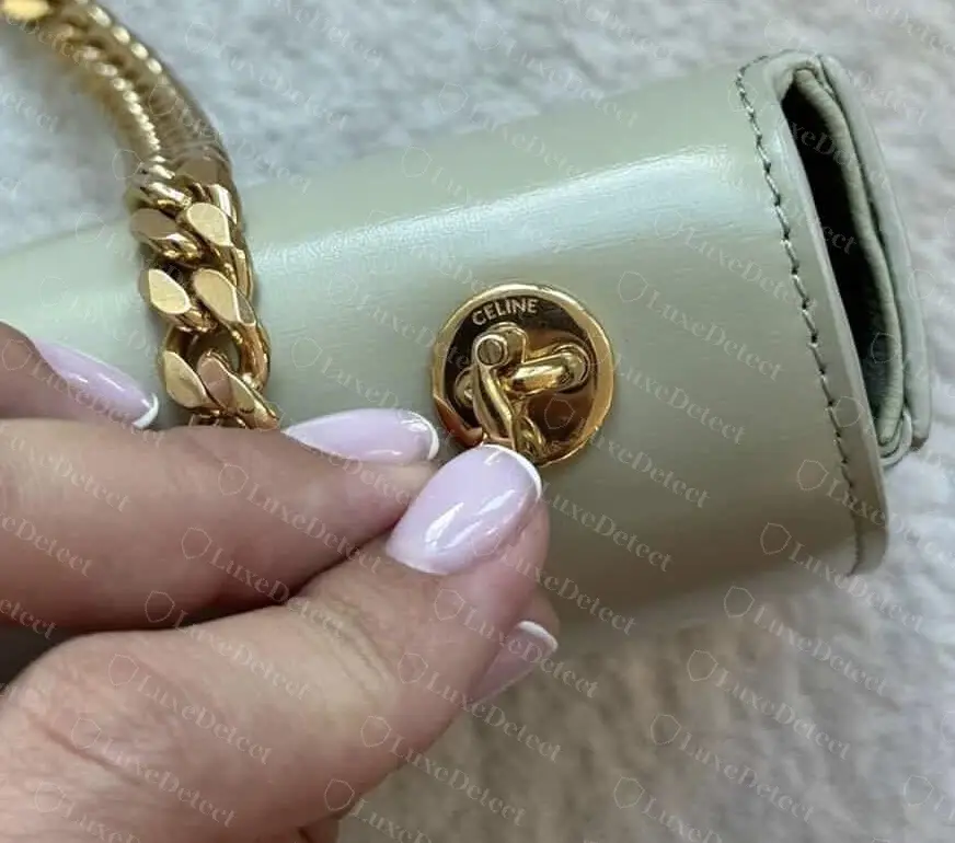 Authentic Teen Triomphe chain anchor: a round gold swivel engraved CELINE, with evenly spaced lettering.