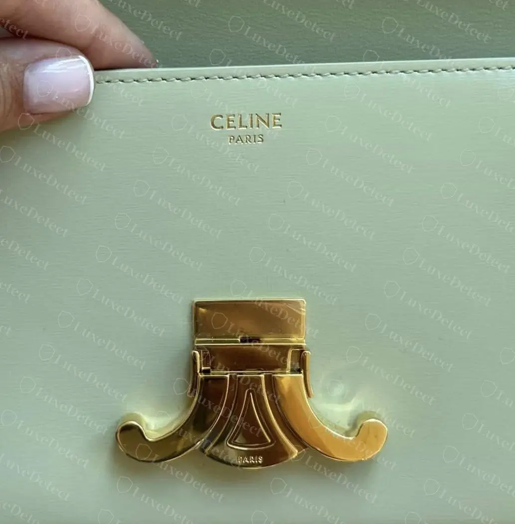 Authentic Teen Triomphe: the gold CELINE PARIS stamp under the flap, above the lower half of the clasp with its engraved PARIS.