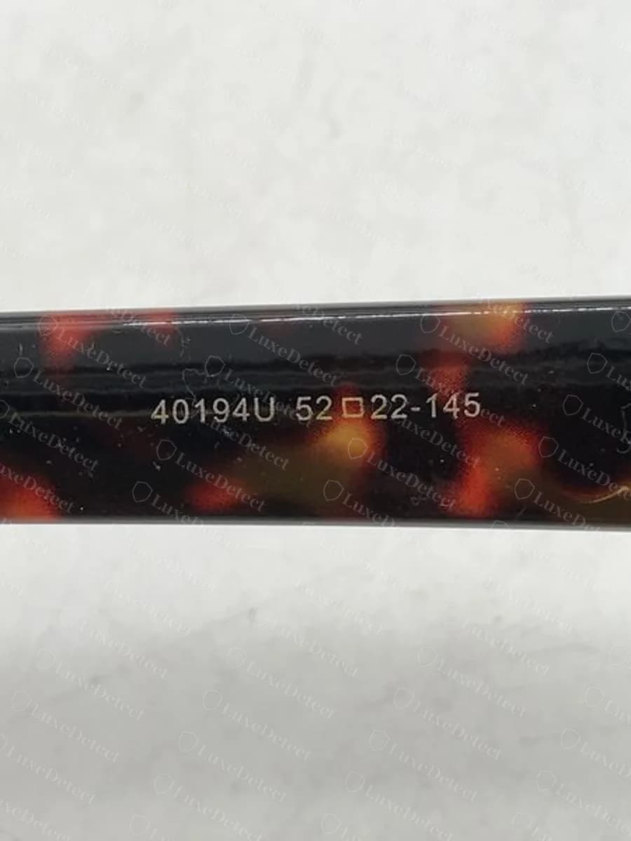 Counterfeit sold as the Triomphe 01: 40194U 52□22-145 with no CL prefix and no colour code.